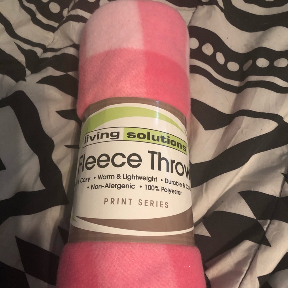 Pink fleece throw blanket.